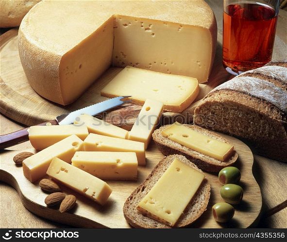 High angle view of cheese with bread and olives