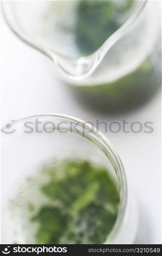 High angle view of chemicals in beakers