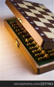 High angle view of chess pieces in a wooden box