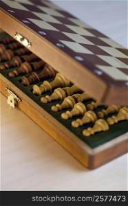 High angle view of chess pieces in a wooden box