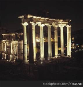 High angle view of columns of a monument lit up at night, Roman Forum, Rome, Italy