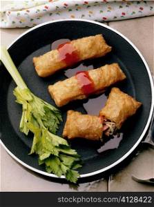 High angle view of egg rolls in a pan