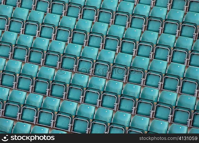 High angle view of empty blue chairs in a stadium