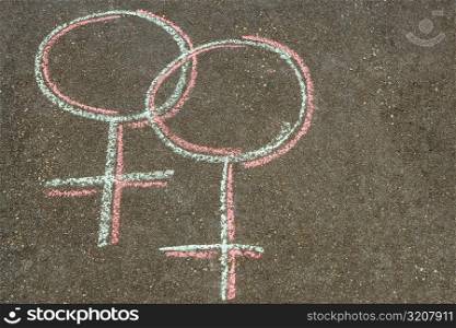 High angle view of female symbols drawn on the road