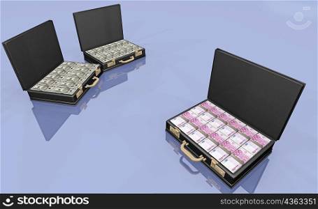 High angle view of five hundred Euro banknotes and American dollar bills in briefcases