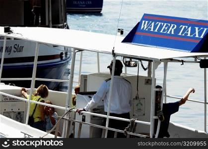 High angle view of four people in a water taxi, Chicago River, Chicago, Illinois, USA