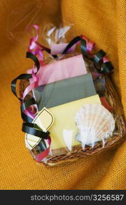 High angle view of greeting cards and a seashell in a basket