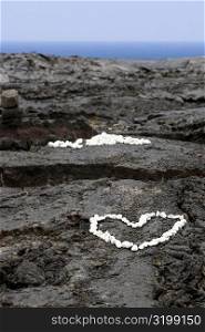 High angle view of heart shaped pebbles on rock, Kona Coast, Big Island, Hawaii Islands, USA