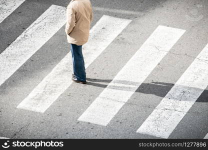 High angle view of Lonely man on crosswalk