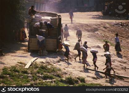 High angle view of manual workers loading a truck, Sagaing, Myanmar
