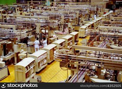 High angle view of manual workers working in a cigarette factory, Richmond, Virginia, USA