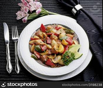 High angle view of pork and sliced vegetables in a dish