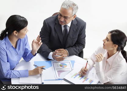 High angle view of professionals discussing together