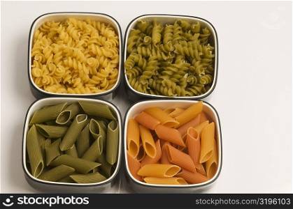 High angle view of raw pasta in bowls