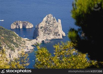 High angle view of rock formations in the sea, Faraglioni Rocks, Capri, Campania, Italy