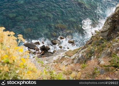 High angle view of rocks in the sea, Italian Riviera, Cinque Terre National Park, Mar Ligure, Cinque Terre, La Spezia, Liguria, Italy