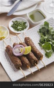High angle view of seekh kabab served in plate at table