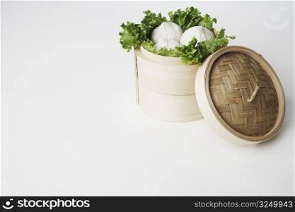 High angle view of steamed dumplings in a steamer