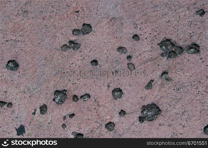 High angle view of stones embedded in sand