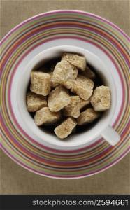 High angle view of sugar cubes in a cup