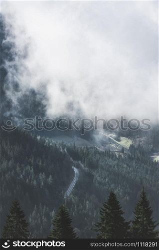High angle view of the black forest and the Hornisgrinde mountains covered by white clouds, in Germany. Spring landscape in trendy aqua menthe color.