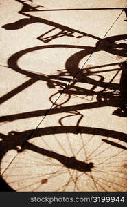 High angle view of the shadow of a bicycle