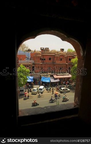 High angle view of the street seen from a arched window, City Palace Jaipur, Rajasthan, India