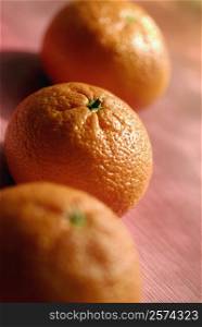 High angle view of three oranges