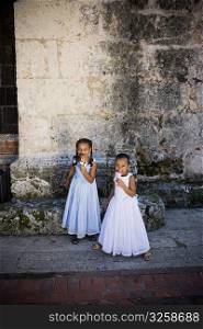 High angle view of two girls eating ice creams, Santo Domingo, Dominican Republic