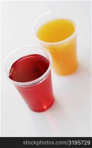 High angle view of two glasses of juice