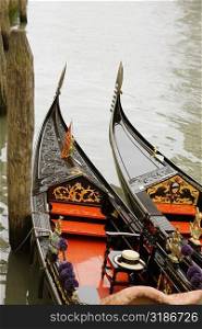 High angle view of two gondolas moored in a canal, Venice, Veneto, Italy