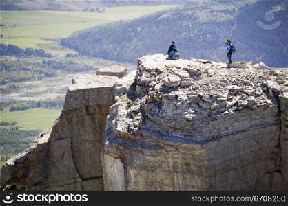 High angle view of two people on a cliff