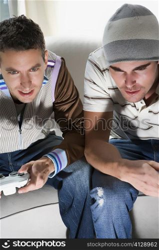 High angle view of two young men playing video game