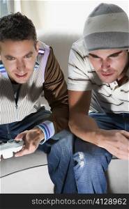 High angle view of two young men playing video game