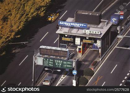 High angle view of vehicles at a toll booth on an expressway, Tokyo Prefecture, Japan