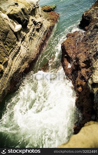 High angle view of water flowing over a rock formation, La Jolla Reefs, San Diego Bay, California, USA