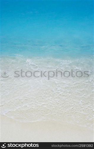High angle view of waves breaking on the beach