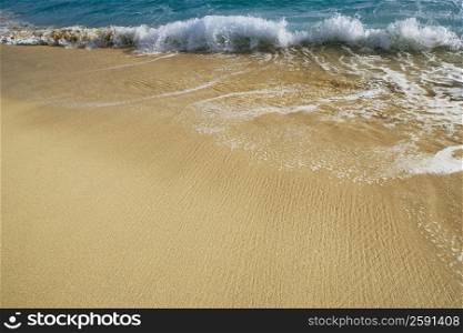 High angle view of waves breaking on the beach