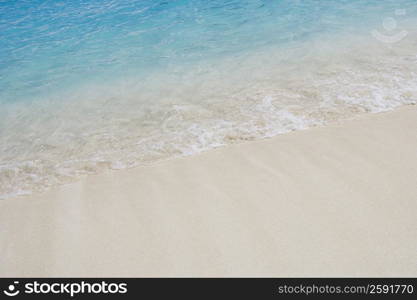 High angle view of waves breaking on the beach