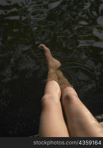 High angle view of woman&acute;s legs in water