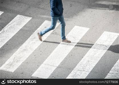 High angle view of young man on crosswalk. City life