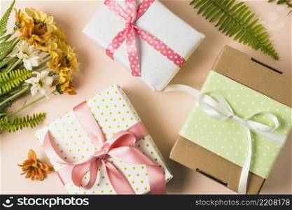 high angle view present boxes flower bouquet with leaves