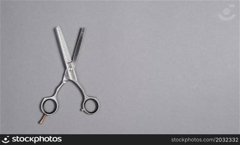high angle view scissors grey background