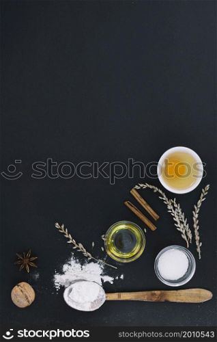 high angle view various baking ingredients black background