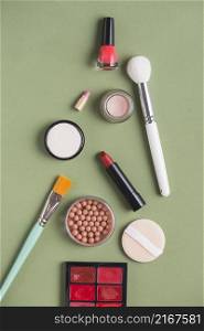 high angle view various makeup products green background