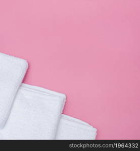 high angle view white towels pink background. High resolution photo. high angle view white towels pink background. High quality photo