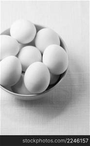 high angle white chicken eggs bowl
