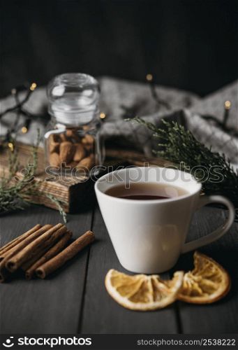 high angle winter drink cup with cinnamon sticks