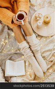 high angle woman enjoying winter holidays with cup tea 2