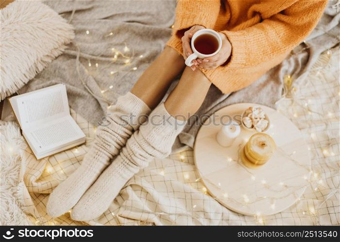 high angle woman enjoying winter holidays with cup tea